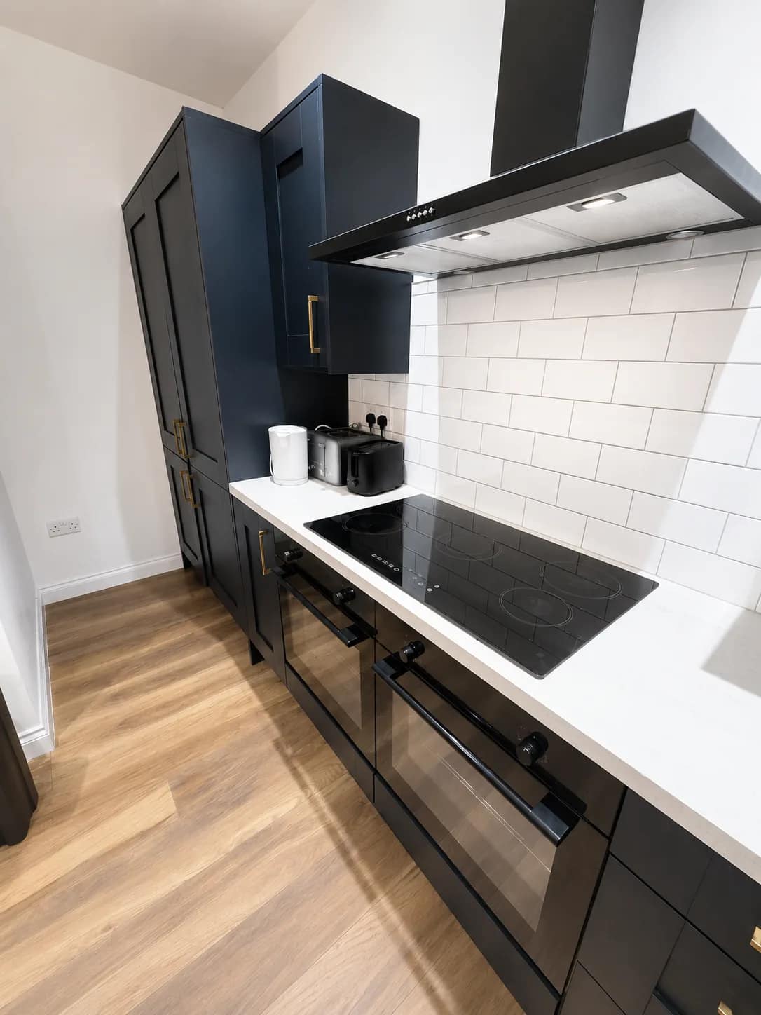 Clean kitchen floor and appliance run after hard floor detailing